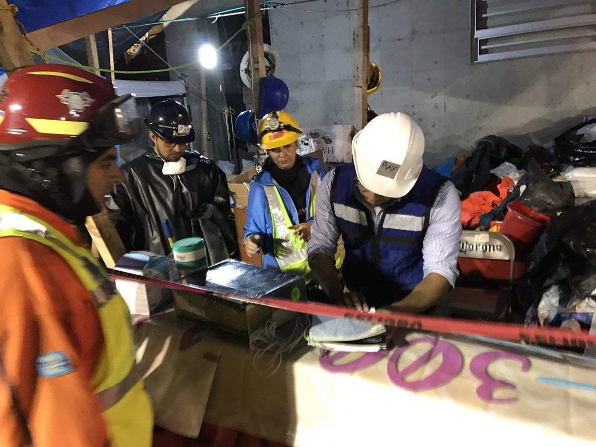Improvised night command post reviewing plans on a supply table during the Mexico City 2017 response.